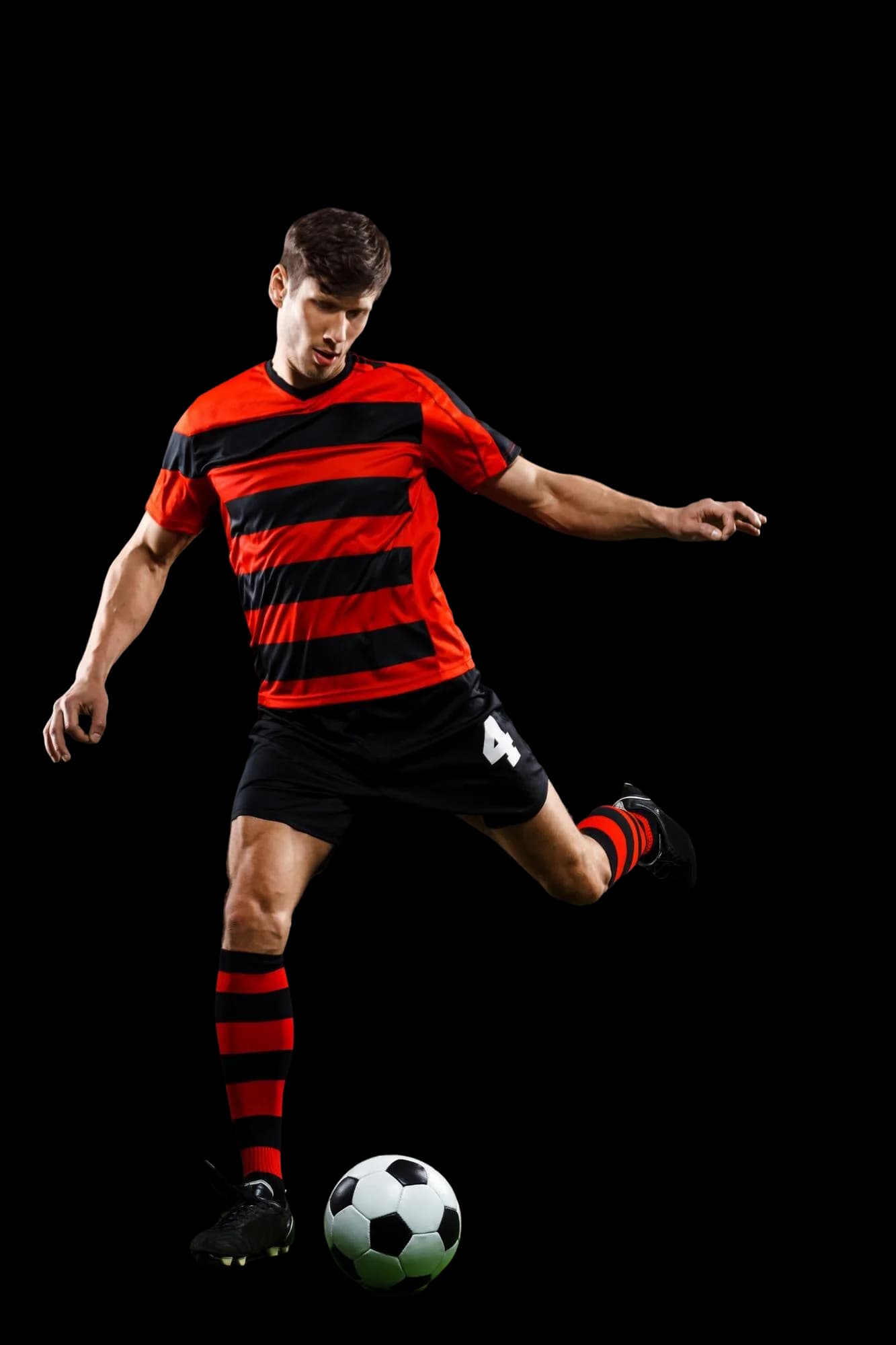 Football player striking the ball